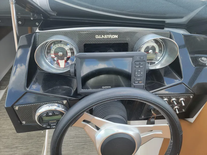 Slide: The Image of 2019 Glastron GTD 220 boat dashboard with Garmin navigation system and gauges. - 10