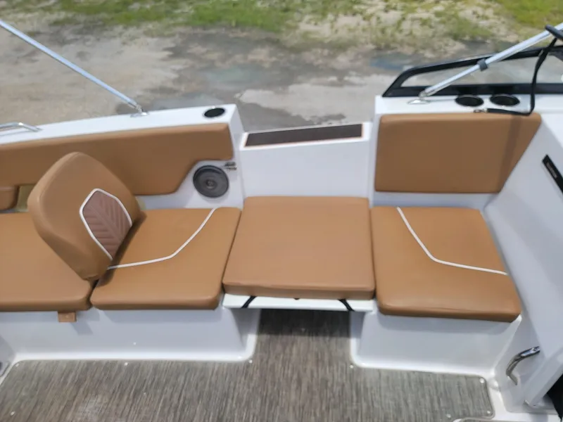 Slide: The Image of 2019 Glastron GTD 220 boat interior with tan cushioned seating. - 12