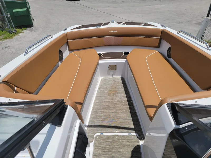 Slide: The Image of 2019 Glastron GTD 220 boat interior with tan seating and open bow. - 18