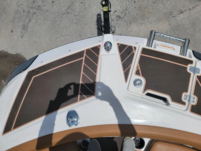 Slide: The Image of 2019 Glastron GTD 220 boat deck with brown and white detailing. - 19
