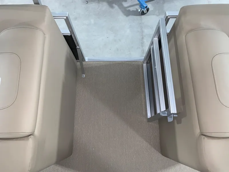 Slide: The Image of 2024 Starcraft LX22 R boat interior with beige seating and foldable gate. - 9