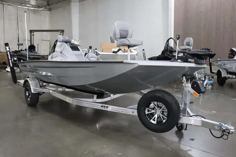 Slide: The Image of 2023 Xpress H17 fishing boat on a trailer in a showroom. - 0