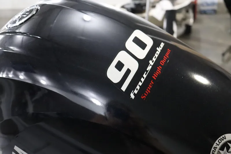 Slide: The Image of Close-up of a 2023 Xpress H17 boat's 90 horsepower four-stroke engine. - 10