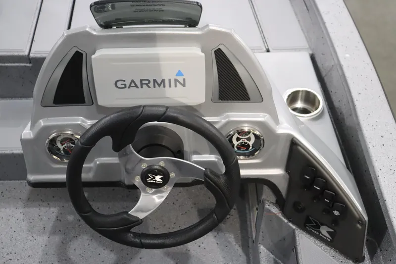 Slide: The Image of 2023 Xpress H17 boat dashboard with Garmin navigation system and steering wheel. - 7