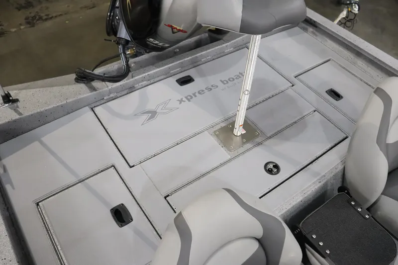 Slide: The Image of 2023 Xpress H17 boat interior with storage compartments and seating. - 9