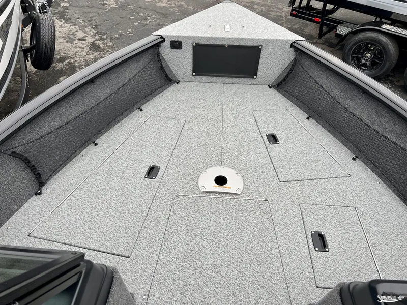 Slide: The Image of 2022 Lund 1875 Impact XS boat deck with storage compartments. - 2