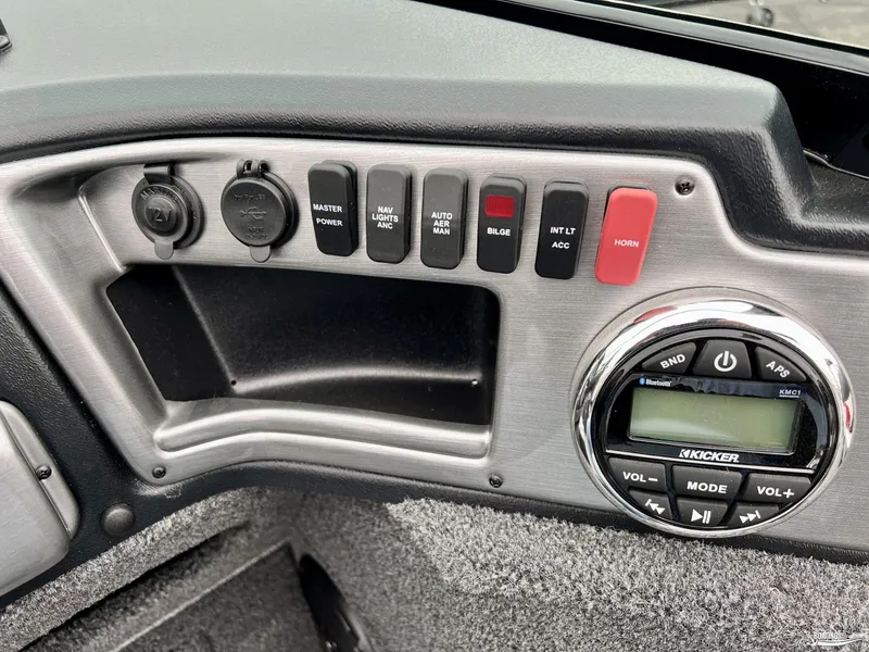 Slide: The Image of Control panel of 2022 Lund 1875 Impact XS boat with switches and audio system. - 5