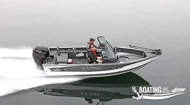 Slide: The Image of 2022 Lund 1875 Impact XS boat speeding on calm water. - 9