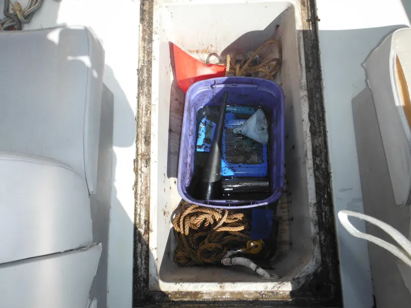 Slide: The Image of Storage compartment on 1989 Wellcraft V20 Steplift boat with ropes and equipment. - 12