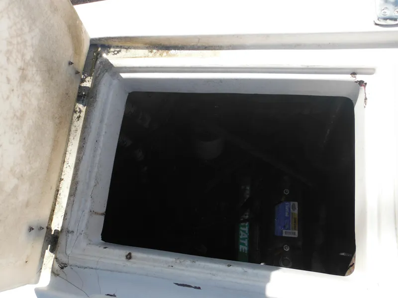 Slide: The Image of Open engine compartment of 1989 Wellcraft V20 Steplift boat, showing interior details. - 14