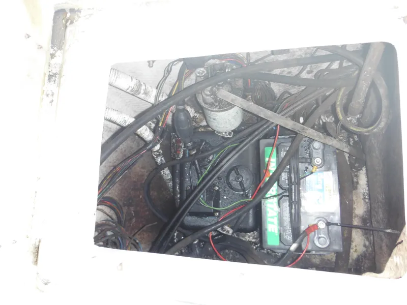 Slide: The Image of Battery compartment of a 1989 Wellcraft V20 Steplift boat with visible wiring. - 15