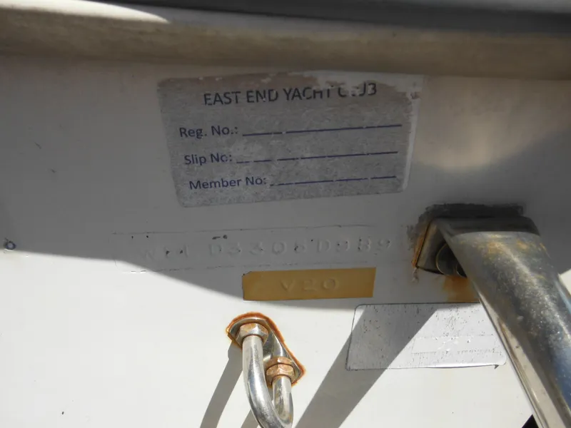 Slide: The Image of 1989 Wellcraft V20 Steplift boat registration area with metal fittings and yacht club label. - 4