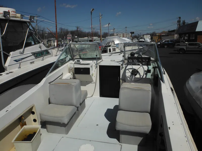 Slide: The Image of 1989 Wellcraft V20 Steplift boat interior with seating and steering wheel. - 6