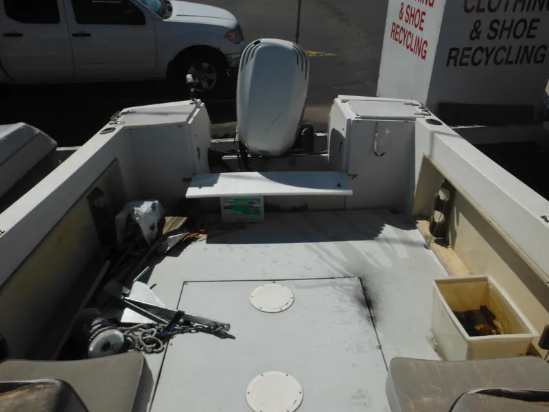 Slide: The Image of 1989 Wellcraft V20 Steplift boat interior with seating and storage compartments. - 7