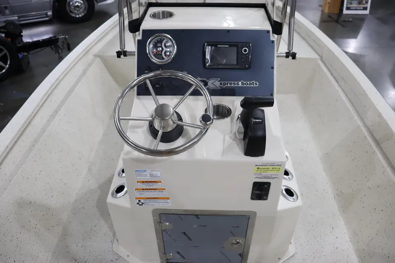 Slide: The Image of 2023 Xpress H190 Bay boat console with steering wheel and navigation controls. - 9