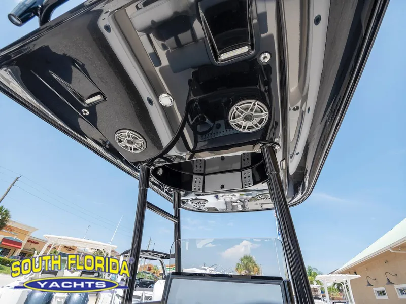 Slide: The Image of 2023 ShearWater 260 Carolina boat with sleek black canopy and speakers, South Florida Yachts. - 18