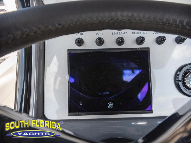 Slide: The Image of 2023 ShearWater 260 Carolina SS dashboard with navigation controls, South Florida Yachts branding. - 21