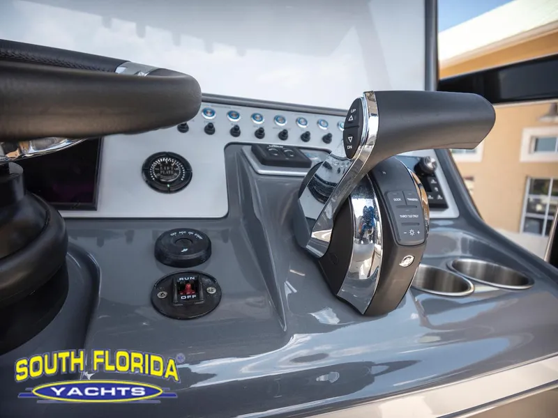 Slide: The Image of 2023 ShearWater 260 Carolina boat controls at South Florida Yachts dealership. - 24
