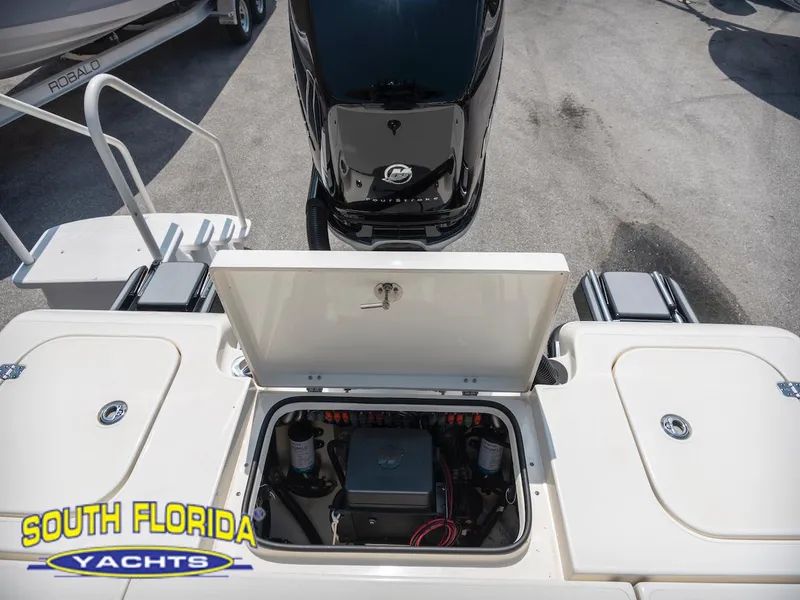 Slide: The Image of 2023 ShearWater 260 Carolina boat engine compartment, South Florida Yachts branding visible. - 29