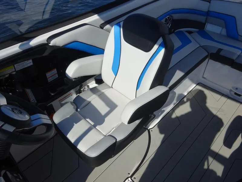 Slide: The Image of 2020 Yamaha Boats 242 X interior with captain's chair and blue accents. - 10