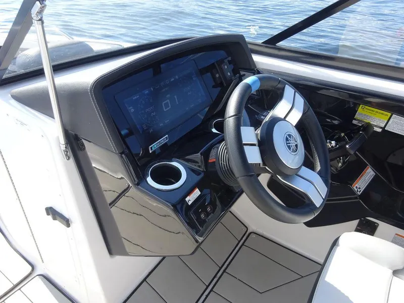 Slide: The Image of 2020 Yamaha Boats 242 X dashboard and steering wheel. - 11