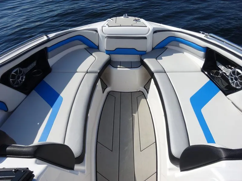 Slide: The Image of 2020 Yamaha Boats 242 X interior seating with blue and white upholstery. - 13