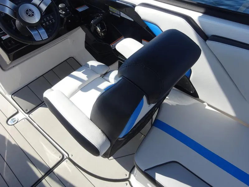 Slide: The Image of 2020 Yamaha Boats 242 X cockpit with steering wheel and seating. - 16