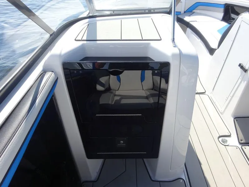 Slide: The Image of 2020 Yamaha Boats 242 X interior cabin with sleek black door. - 6
