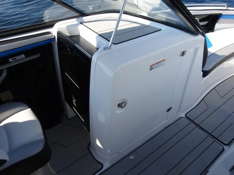 Slide: The Image of 2020 Yamaha Boats 242 X interior, showing sleek design and storage compartments. - 8