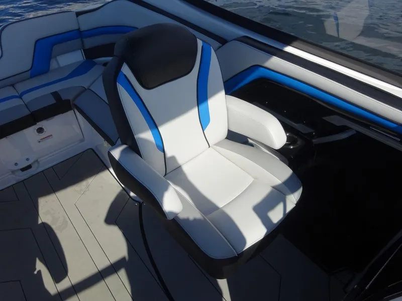 Slide: The Image of 2020 Yamaha Boats 242 X interior seating with blue and white upholstery. - 9