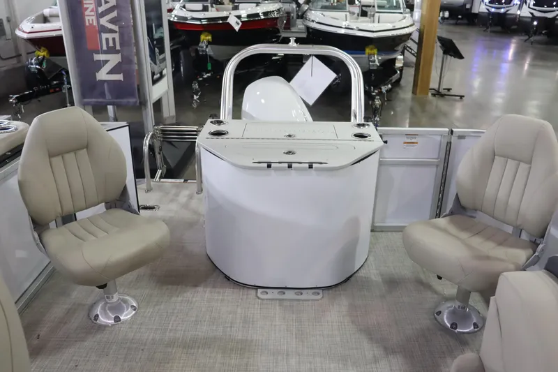 Slide: The Image of 2023 Silver Wave 2210 SW5 RLP boat interior with beige seats and control console. - 11