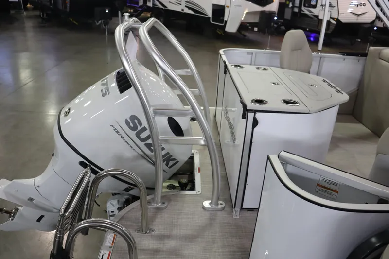 Slide: The Image of 2023 Silver Wave 2210 SW5 RLP boat with Suzuki outboard motor and seating area. - 12