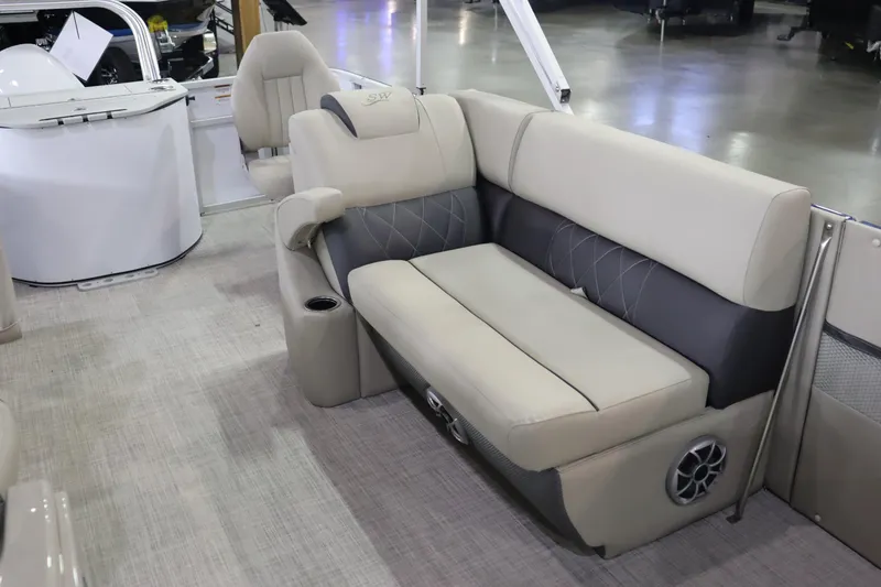 Slide: The Image of 2023 Silver Wave 2210 SW5 RLP boat interior with beige and gray seating. - 7