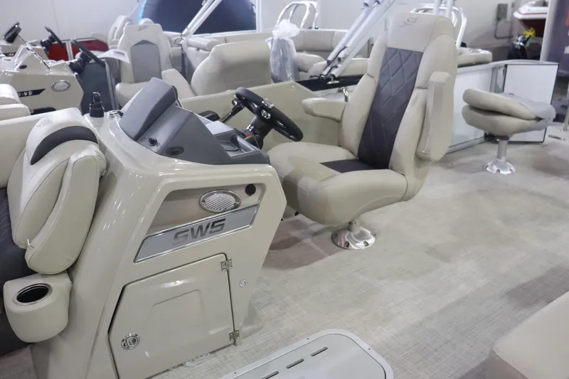 Slide: The Image of 2023 Silver Wave 2210 SW5 RLP boat interior with beige seating and steering console. - 8