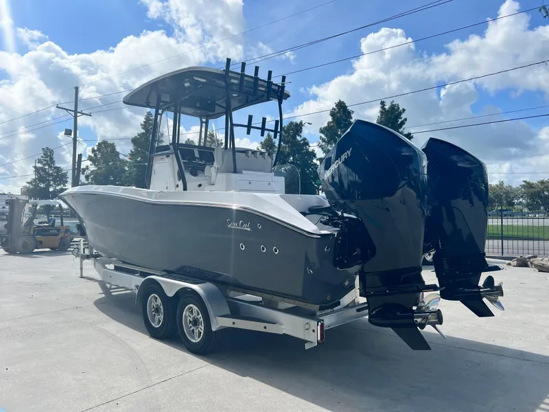 Slide: The Image of 2023 Sea Cat 262 HC boat on trailer with twin Mercury outboard engines. - 6
