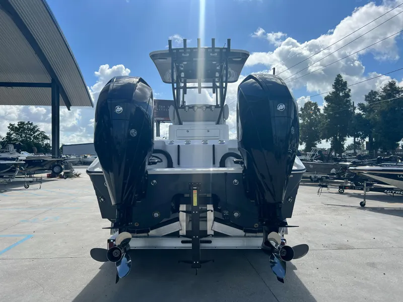 Slide: The Image of 2023 Sea Cat 262 HC boat with dual outboard motors, rear view. - 7
