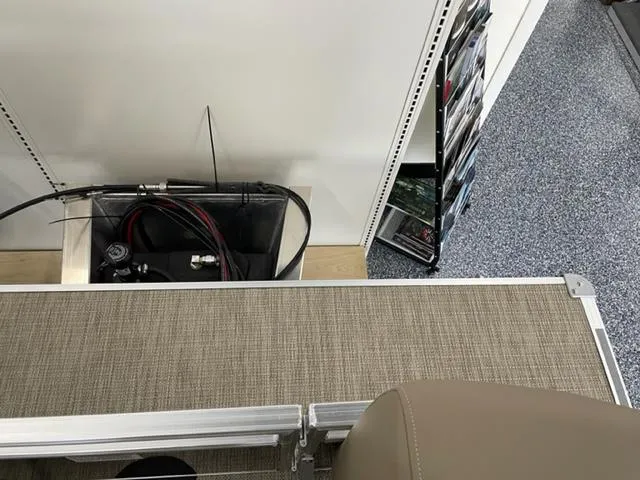 Slide: The Image of 2023 Starcraft LX 16 R boat interior with storage compartment and accessories. - 15