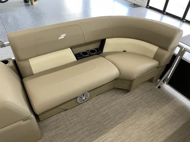 Slide: The Image of 2023 Starcraft LX 16 R boat interior with beige seating and cup holders. - 5