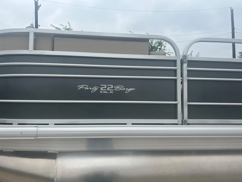 Slide: The Image of 2023 Sun Tracker Party Barge 22 RF DLX pontoon boat side view. - 4