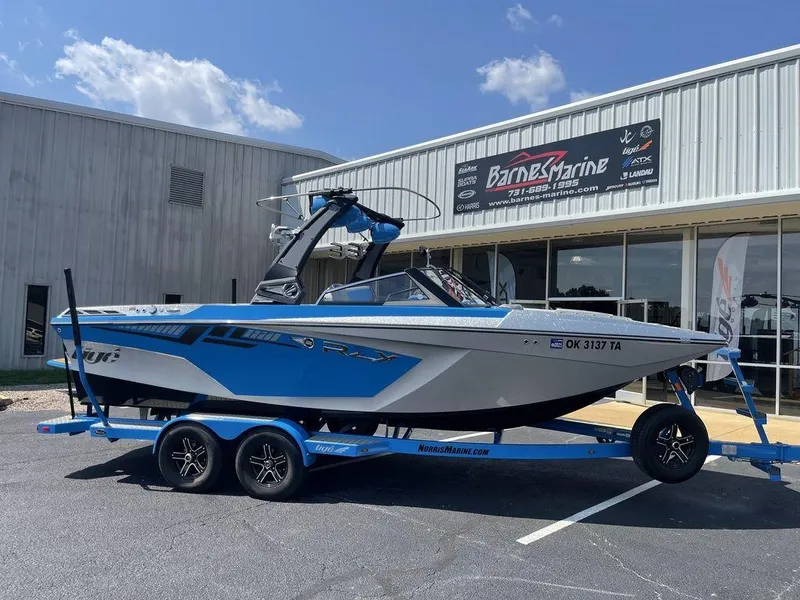 The Image of 2017 Tigé RZX2 boat on a trailer outside Barnes Marine dealership. - 0