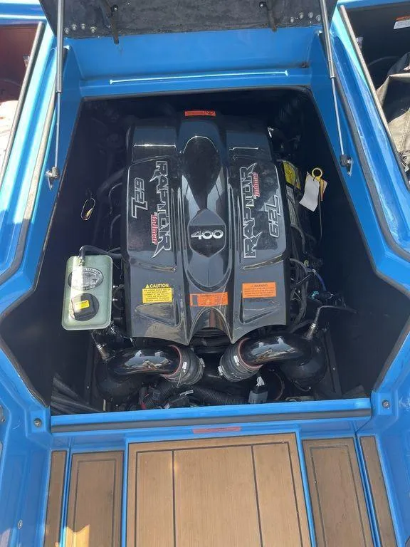 Slide: The Image of 2017 Tigé RZX2 boat engine compartment with Raptor 400 engine. - 10