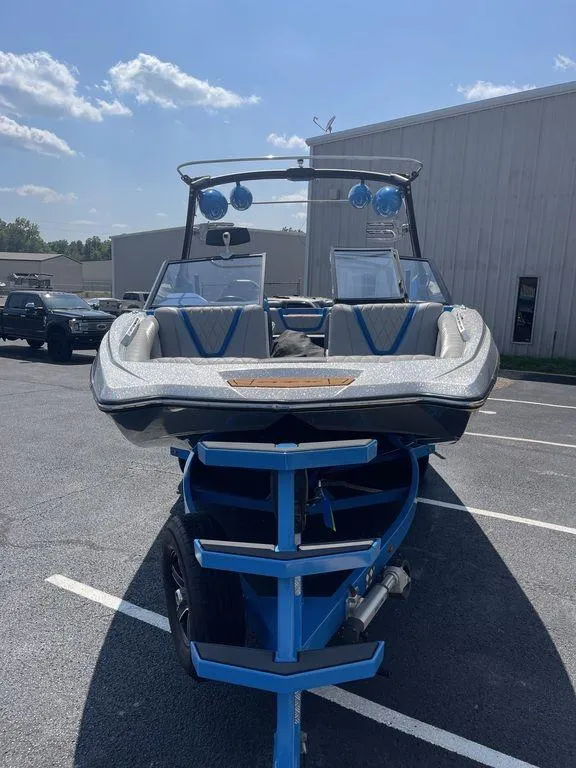 Slide: The Image of 2017 Tigé RZX2 boat on a trailer in a parking lot. - 6