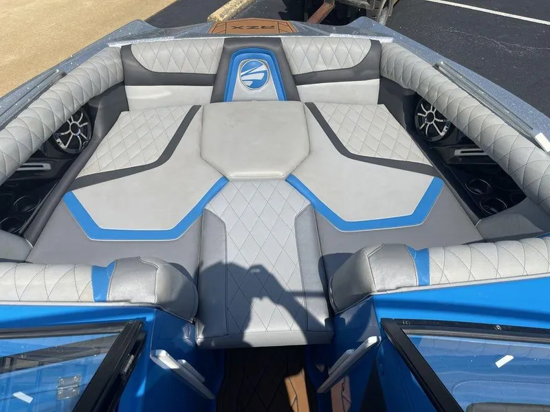 Slide: The Image of 2017 Tigé RZX2 boat interior with blue and gray upholstery. - 8