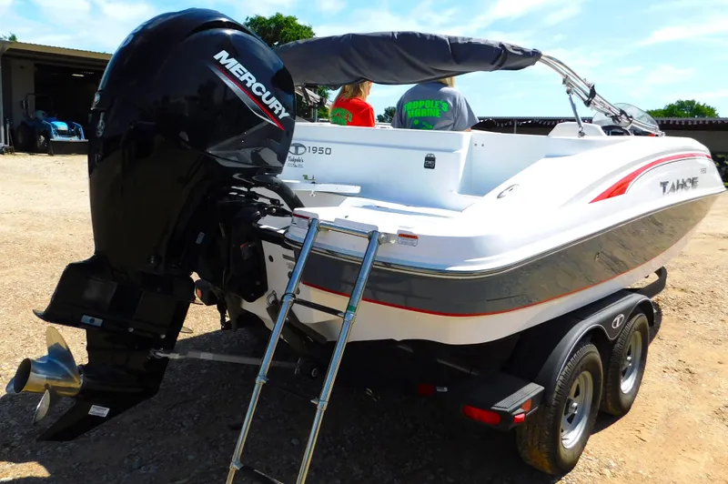 Slide: The Image of 2023 Tahoe 1950 boat with Mercury outboard motor on trailer. - 12