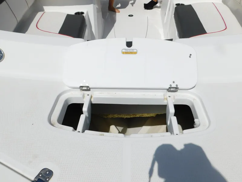 Slide: The Image of Open storage compartment on a 2023 Tahoe 1950 boat. - 27