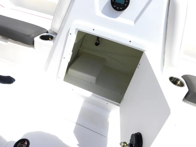 Slide: The Image of Open storage compartment on a 2023 Tahoe 1950 boat with seating and cup holders. - 29
