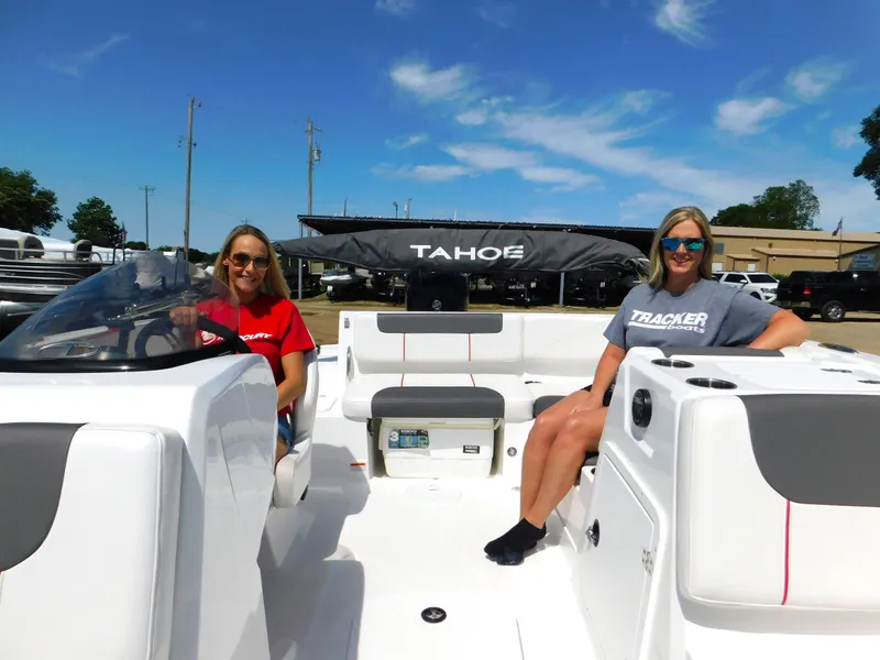 Slide: The Image of Two women on a 2023 Tahoe 1950 boat, sunny day, smiling. - 4