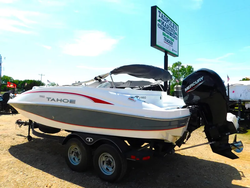 Slide: The Image of 2023 Tahoe 1950 boat with Mercury outboard motor on trailer. - 7