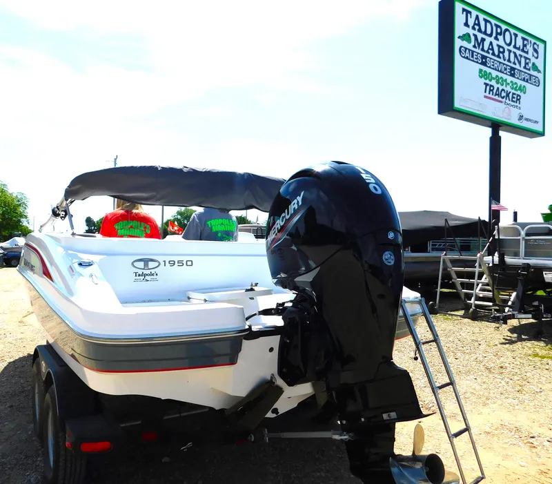 Slide: The Image of Tahoe 1950 boat 2023 model at Tadpole's Marine, featuring a Mercury outboard motor. - 8