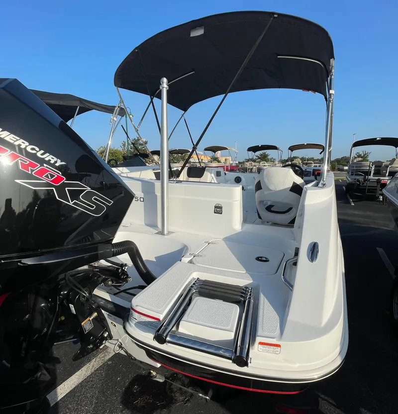 Slide: The Image of 2023 Tahoe 1950 boat with Mercury Pro XS engine and bimini top. - 3